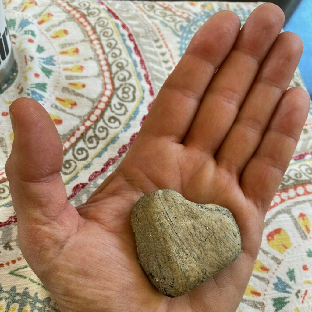 Marc's Hand holding Heart Rock